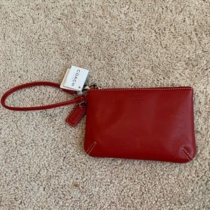 NWT Coach red leather wristlet.
